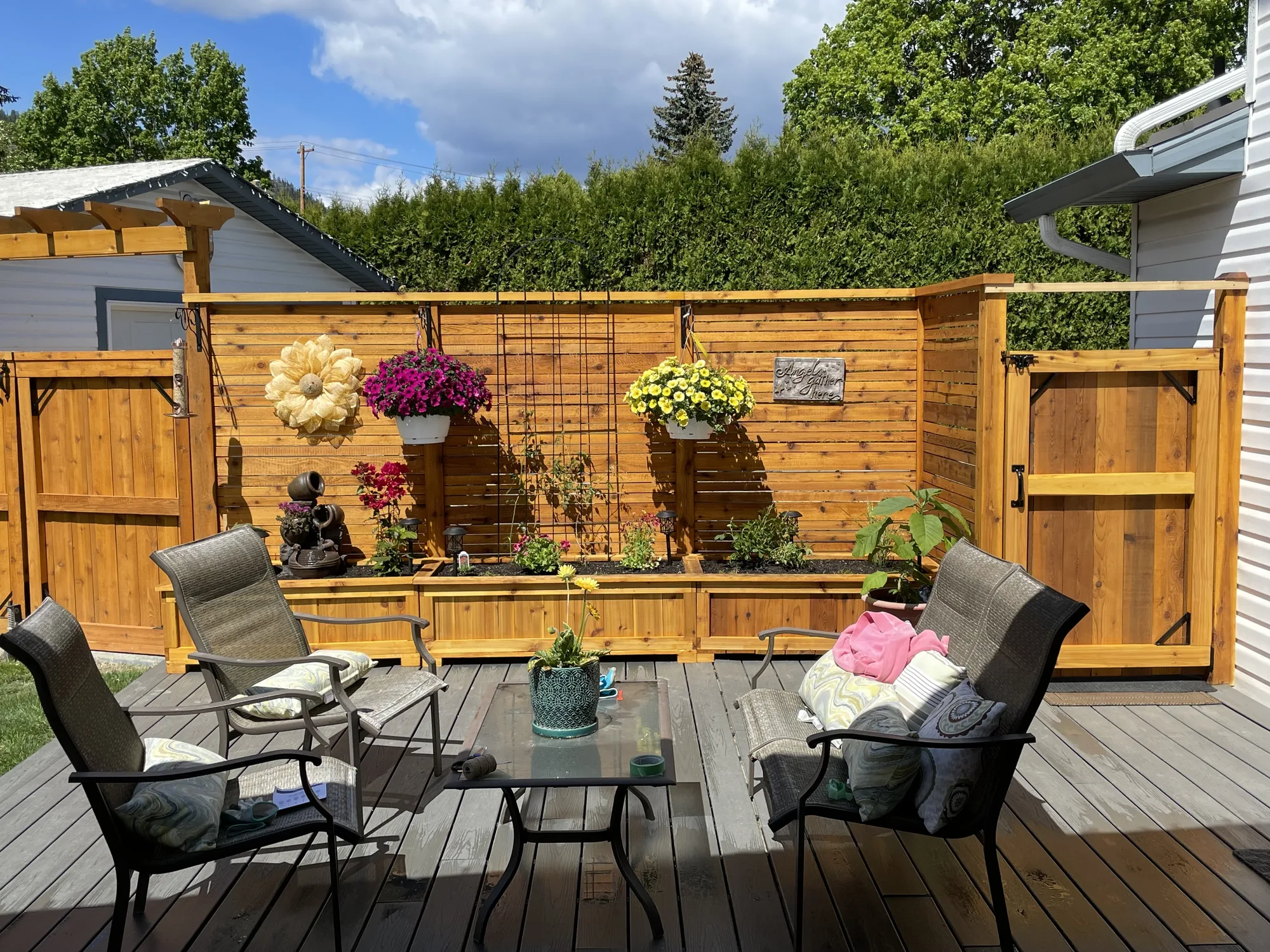 Cedar fence and planter by a patio