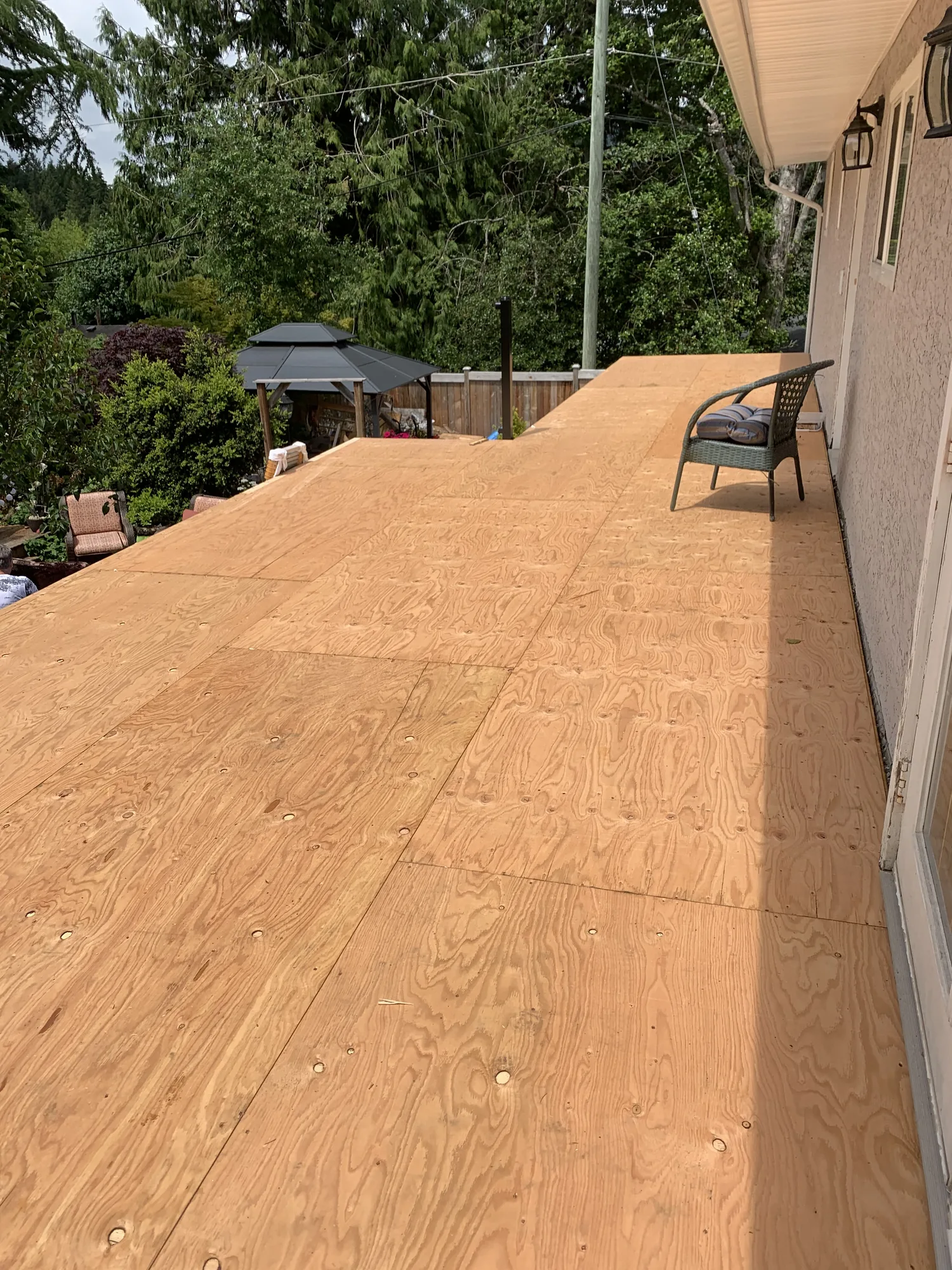 New deck extension framing with plywood subfloor