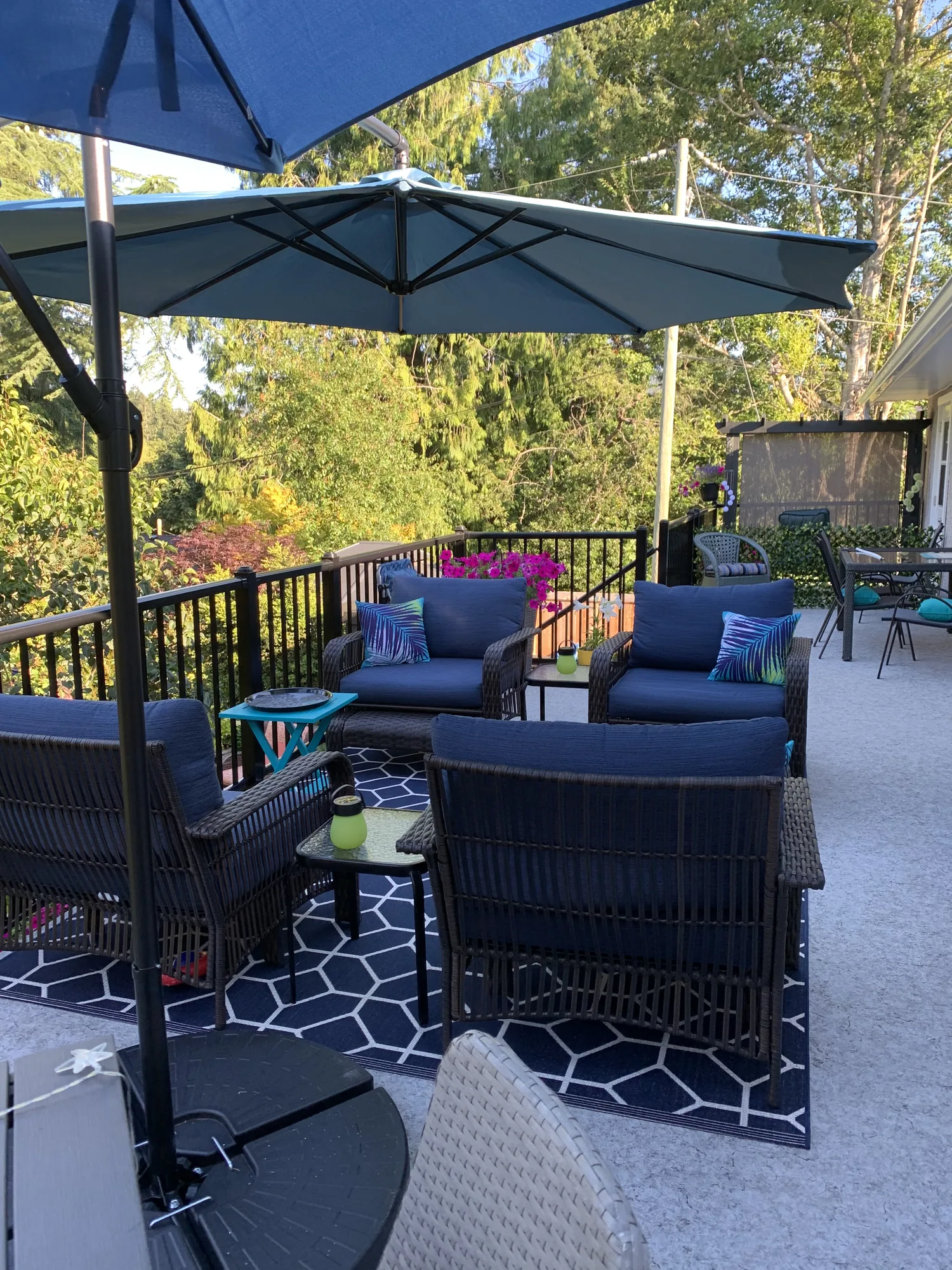 Finished patio lounge area under an umbrella
